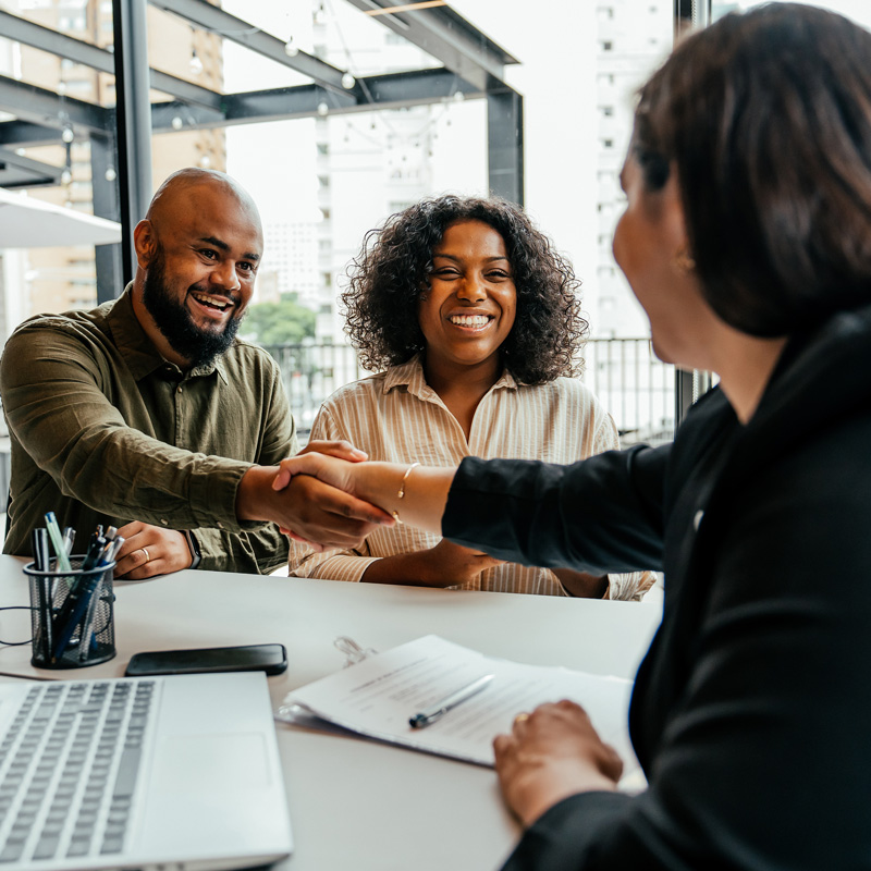 people shaking hands during a meeting