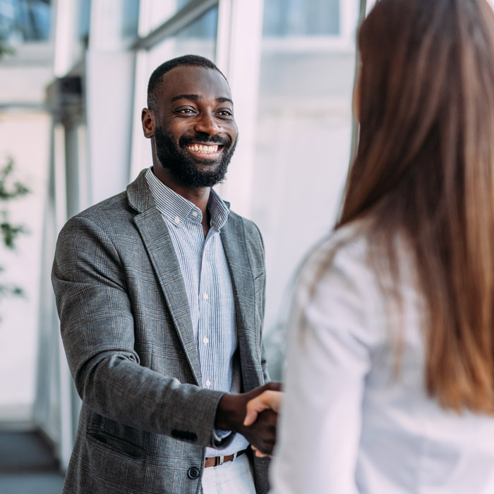 Business people shaking hands in the office.